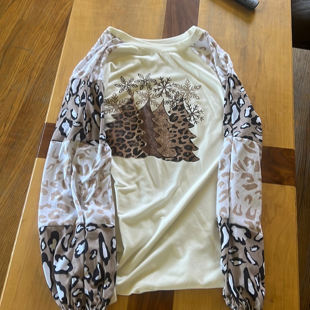 White long sleeve cheetah print Christmas tree shirt. Only worn once. Large.